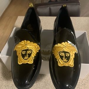 Versace black leather loafers , with gold stitching!